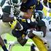 Michigan quarterback Denard Robinson is roughed up by a pair of Michigan State University tacklers on a first quarter carry in Saturday, October 9th's clash between the in-state rivals at Michigan Stadium.
Lon Horwedel | AnnArbor.com